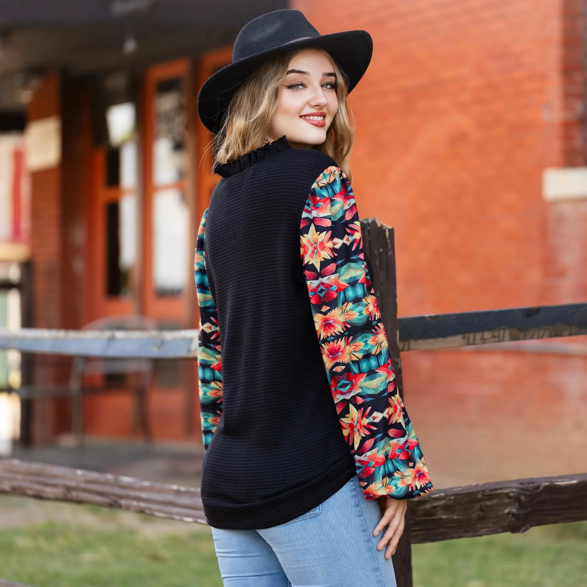 Black waffle knit top with printed bubble sleeves