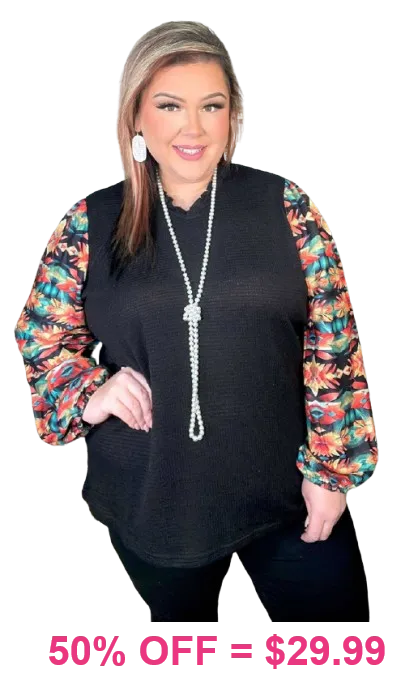 Black waffle knit top with printed bubble sleeves