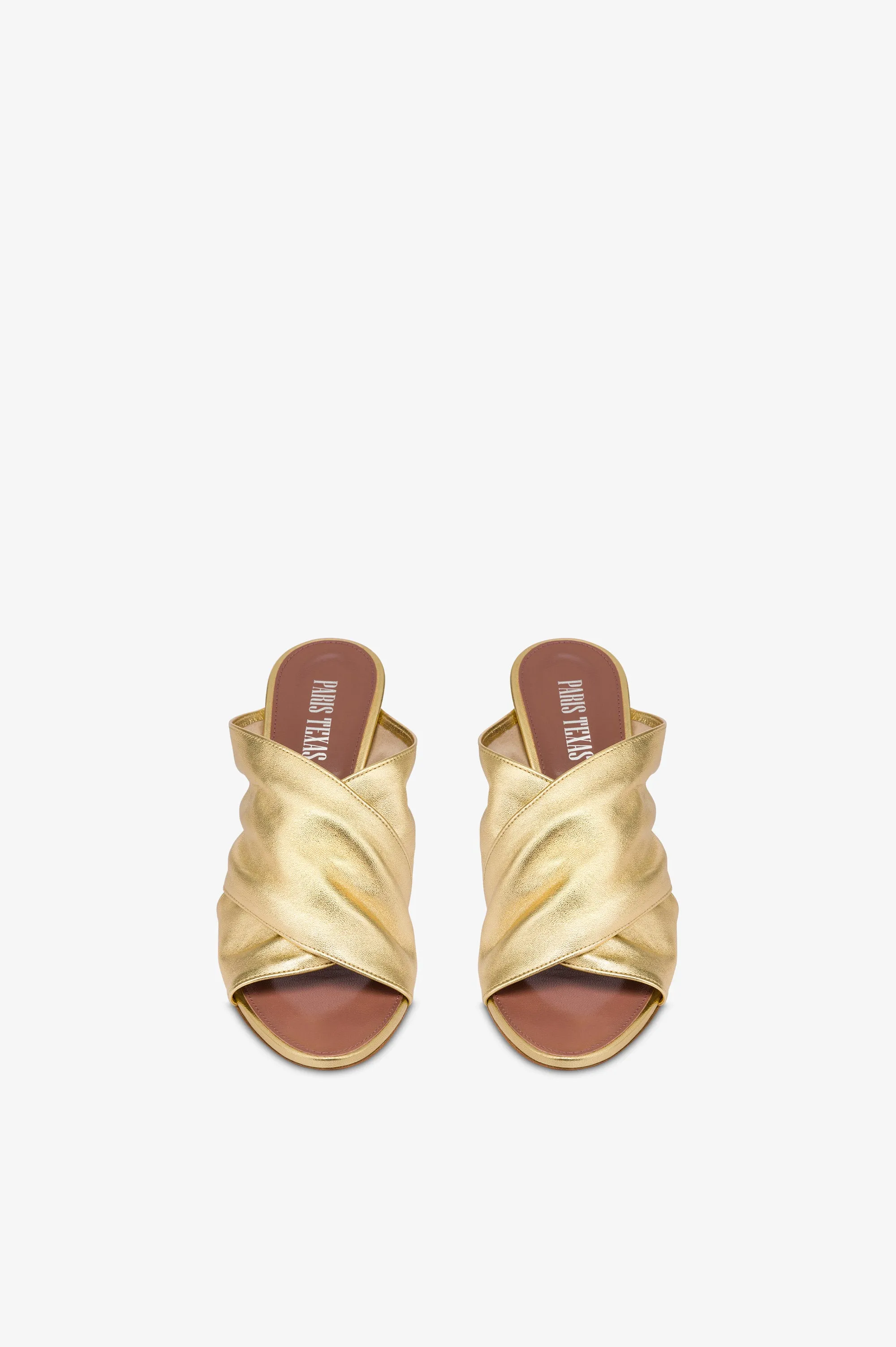 Mules in gold metallic leather