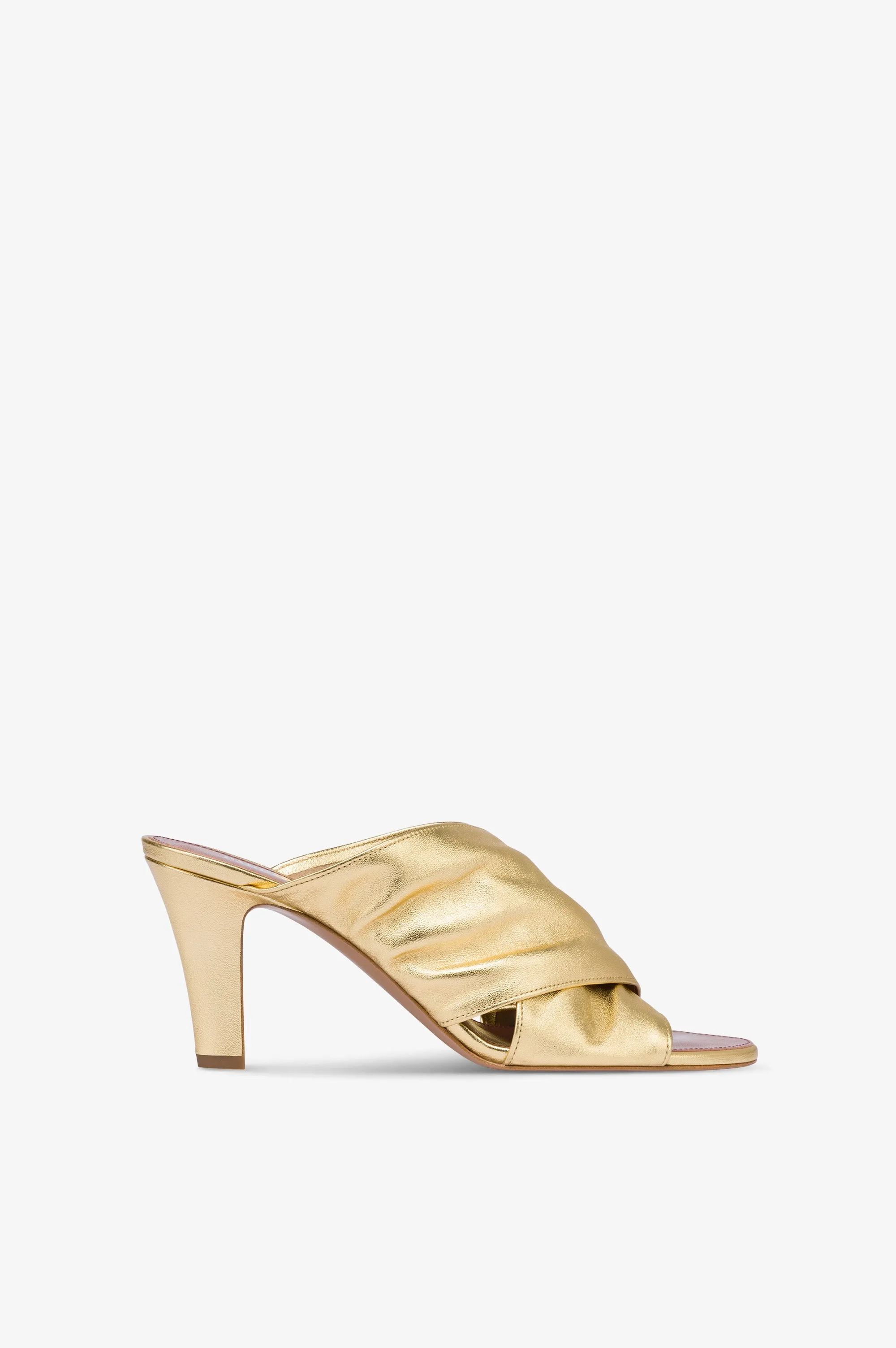 Mules in gold metallic leather