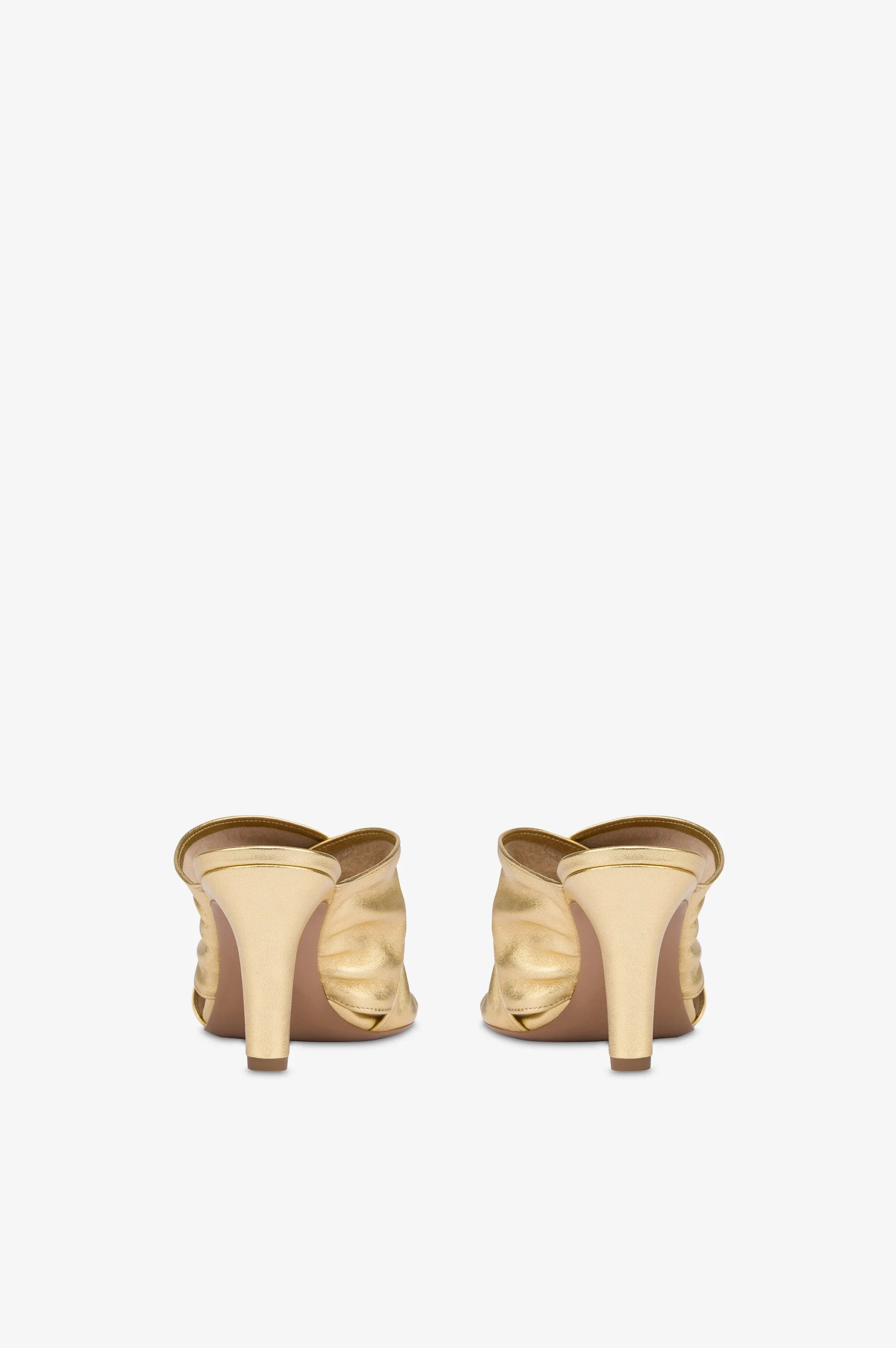 Mules in gold metallic leather