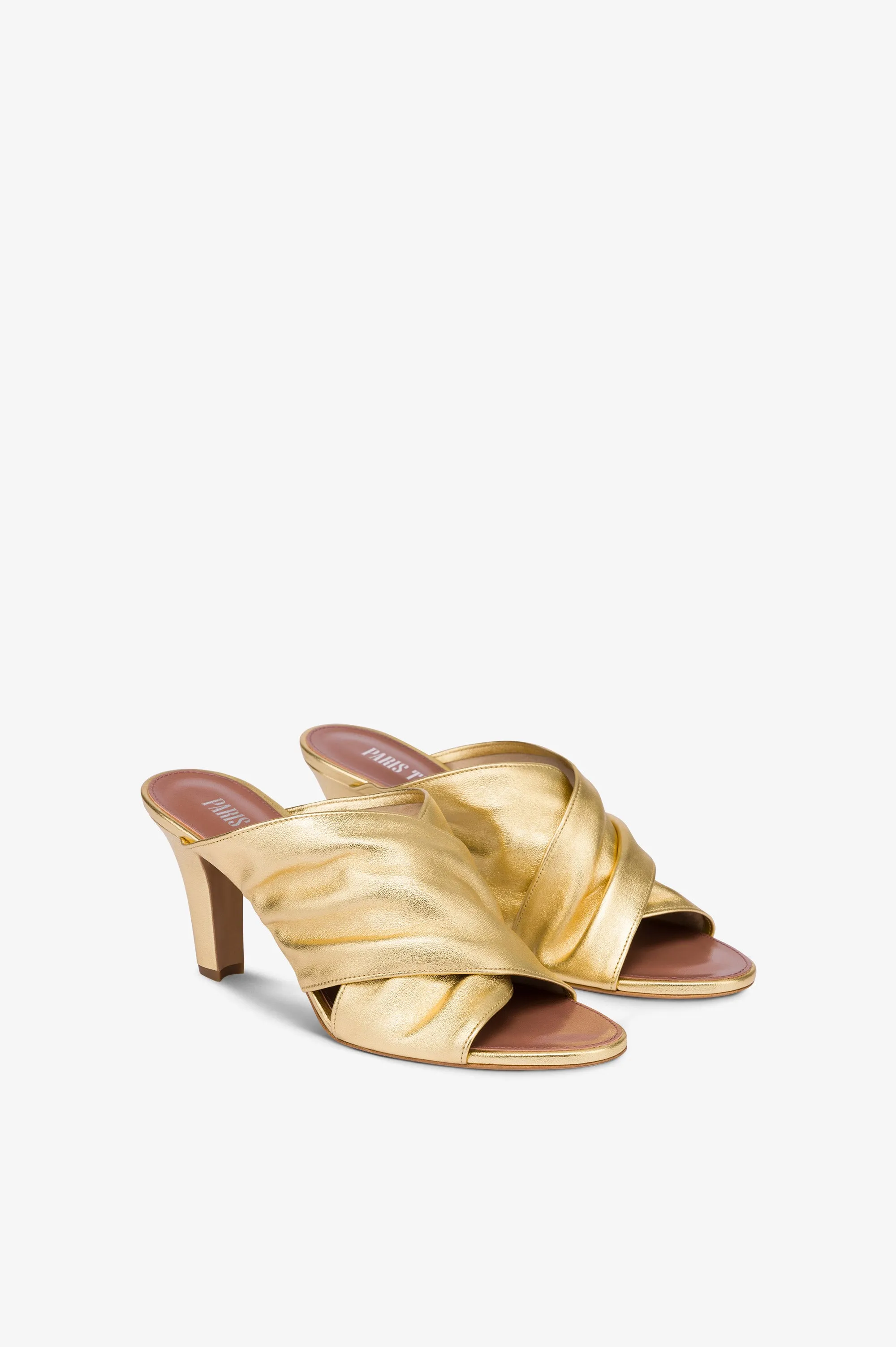 Mules in gold metallic leather